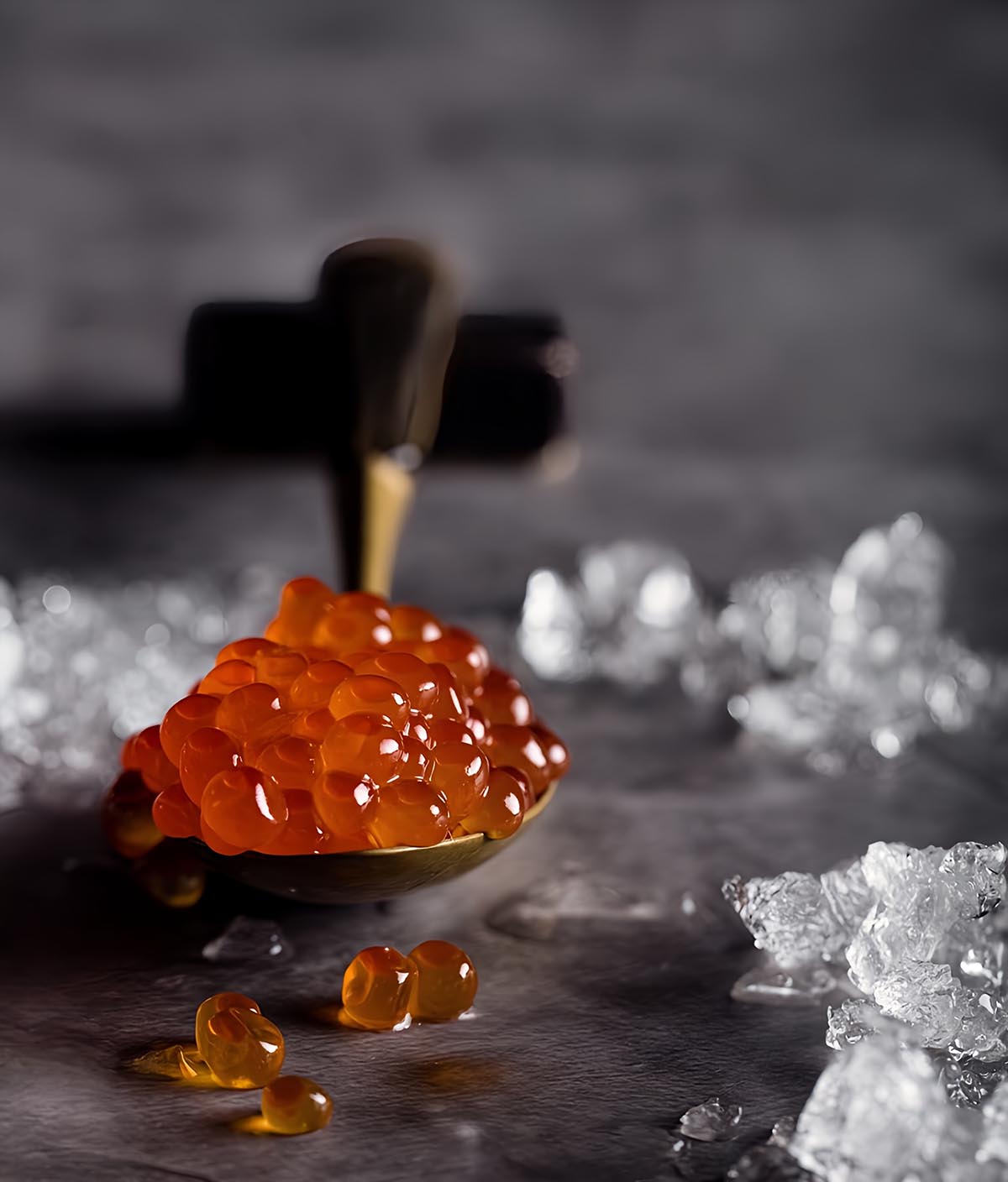 Spoonful of ikura salmon roe on ice at Togyushi